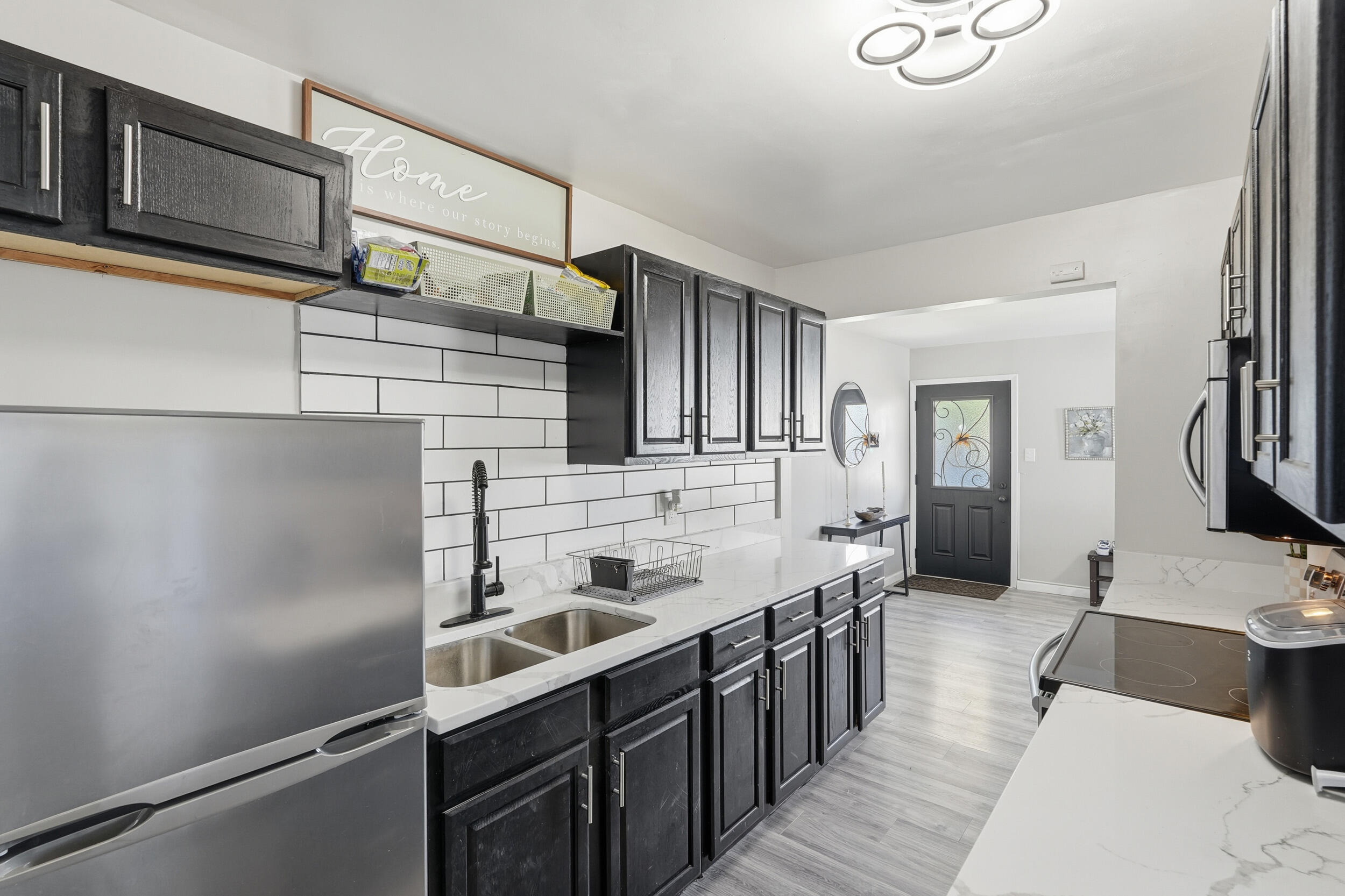 3737 Fillmore Street Gary, IN 46408 - Photo 10 of 19 a kitchen with stainless steel appliances a sink and cabinets