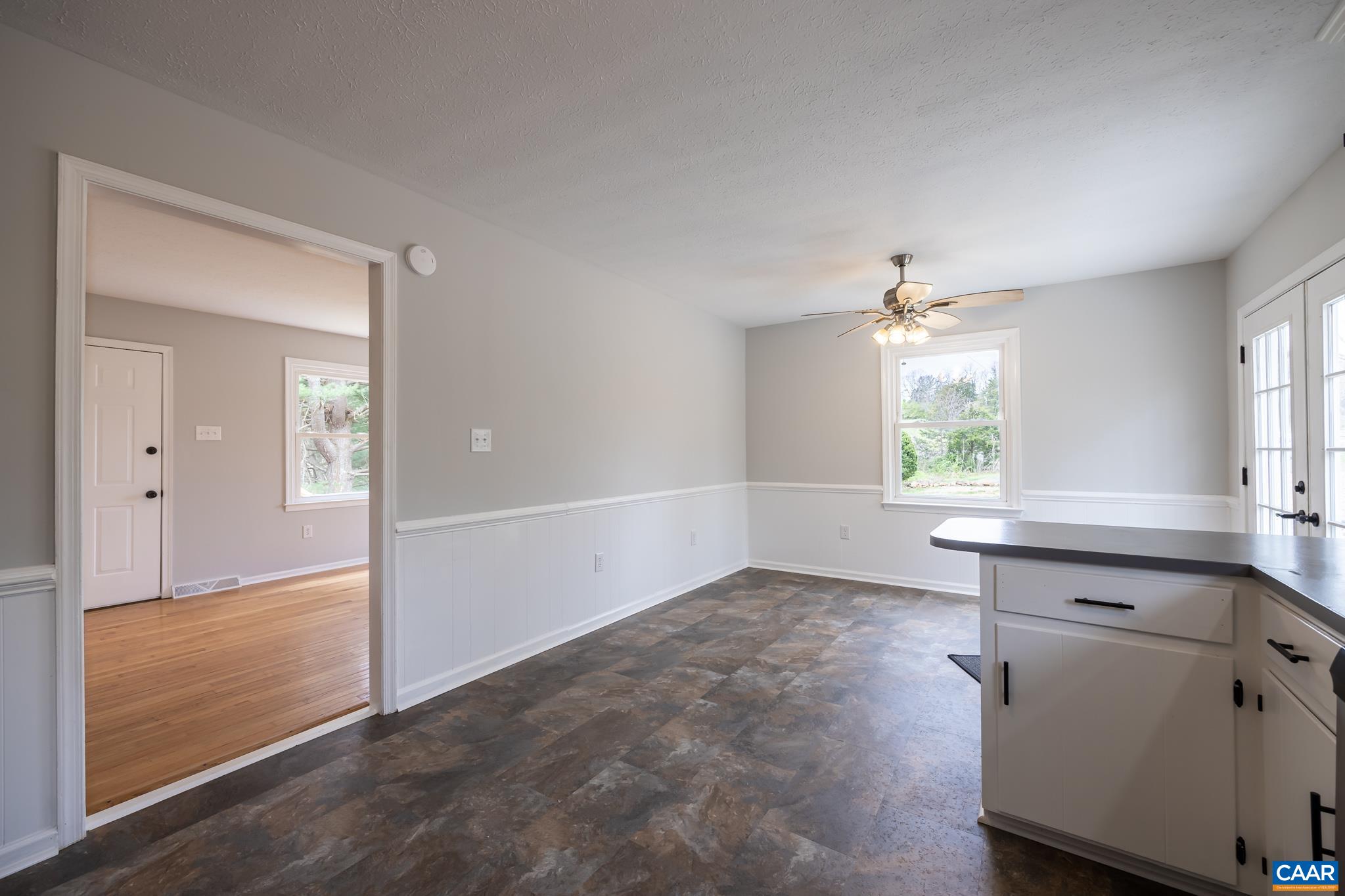 7971 Irish Road Faber, VA 22938 - Photo 6 of 23 an empty room with windows and cabinet