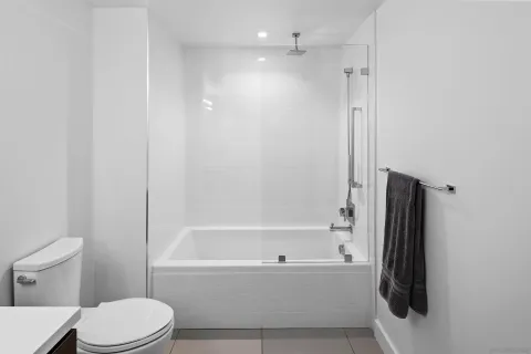 a bathroom with a toilet and a bathtub