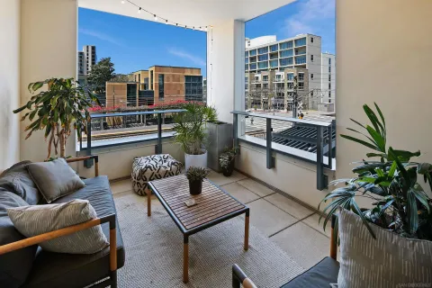 a living room with furniture plant and a potted plant