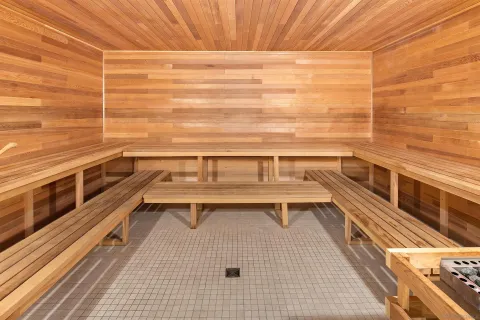 a bed sitting in a bedroom next to a dining table