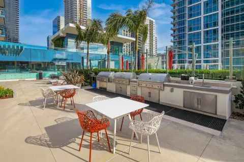a lobby with gym equipment and lots of glass windows