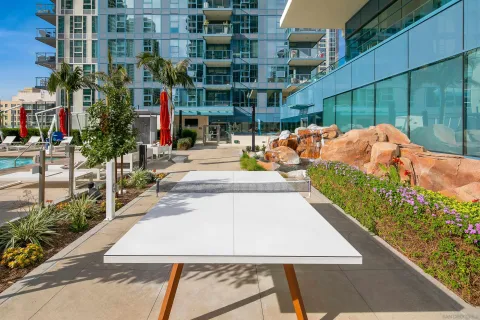 a room with gym equipment and glass door