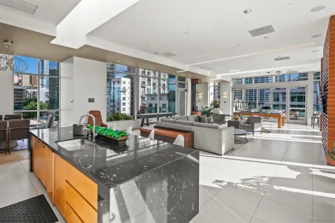 a view of a terrace with couches and a table and chairs