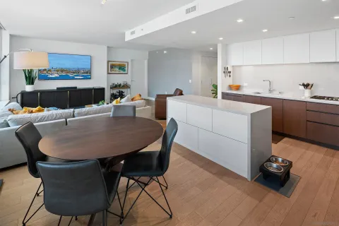 a large kitchen with a table and chairs in it