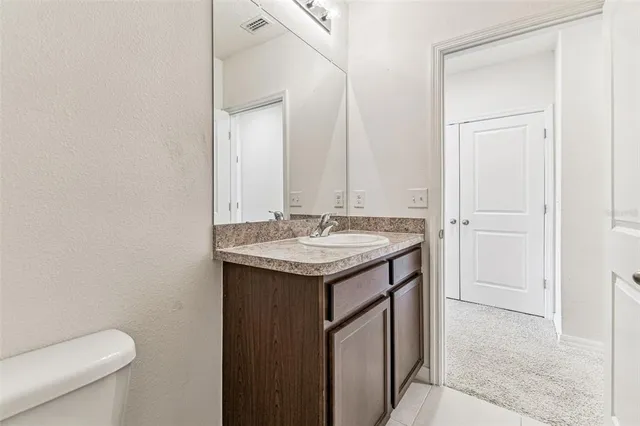 a view of a hallway with staircase