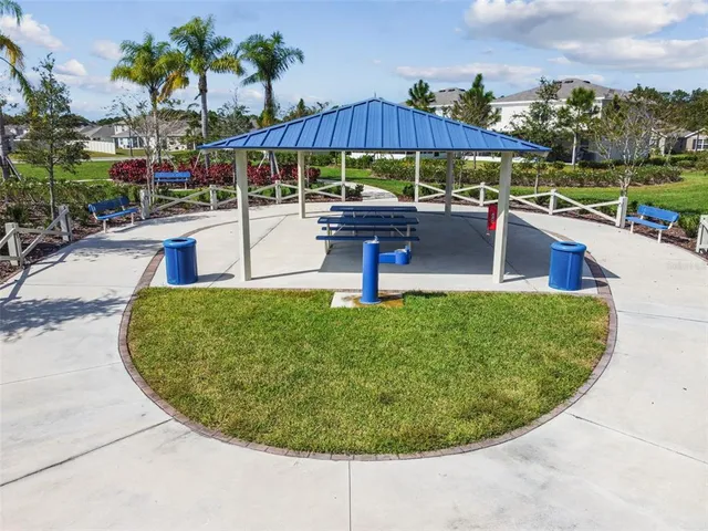 a view of a patio with table and chairs