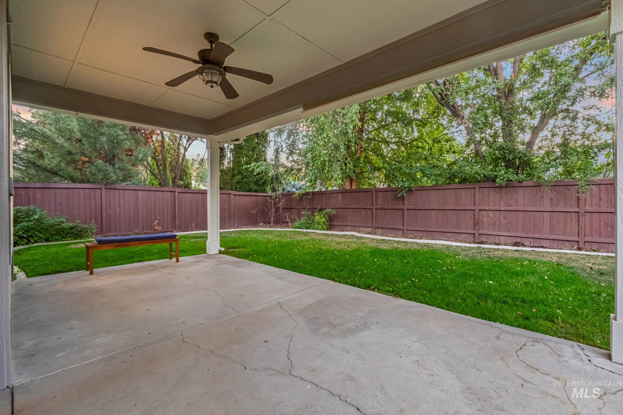 6099 North Heathrow Way Boise, ID 83713 - Photo 30 of 39 Fenced backyard with a ceiling fan and a patio area