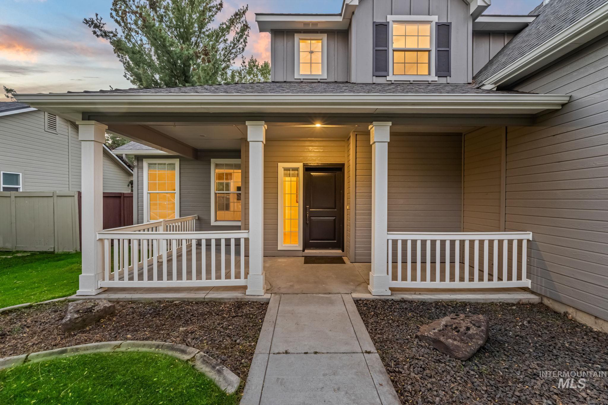 6099 North Heathrow Way Boise, ID 83713 - Photo 3 of 39 Entrance to property with board and batten siding and a porch