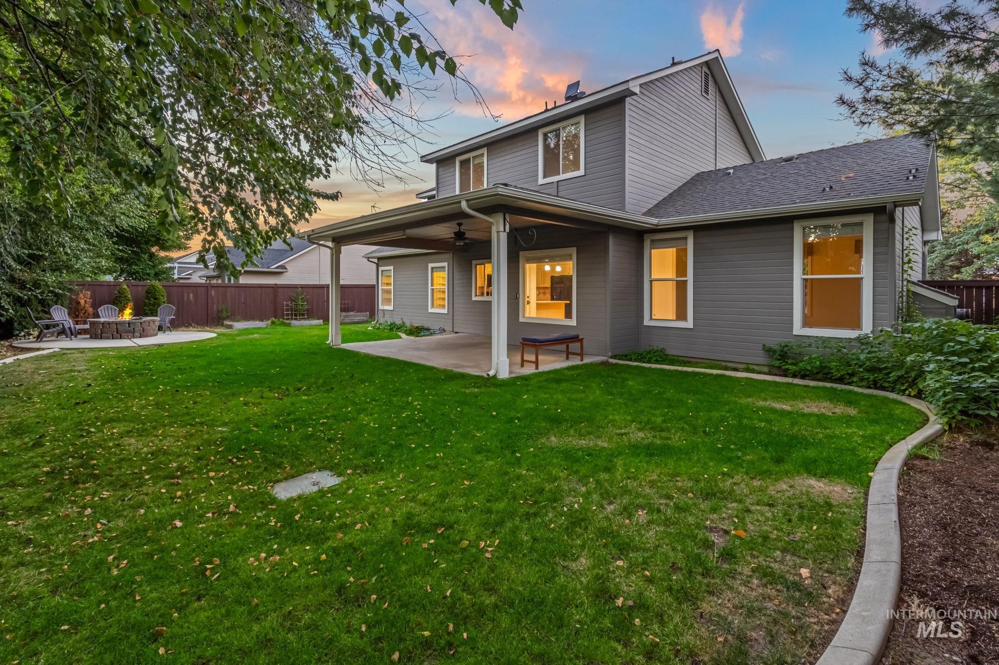 6099 North Heathrow Way Boise, ID 83713 - Photo 32 of 39 Rear view of property featuring a patio area, a fenced backyard, a ceiling fan, and a chimney