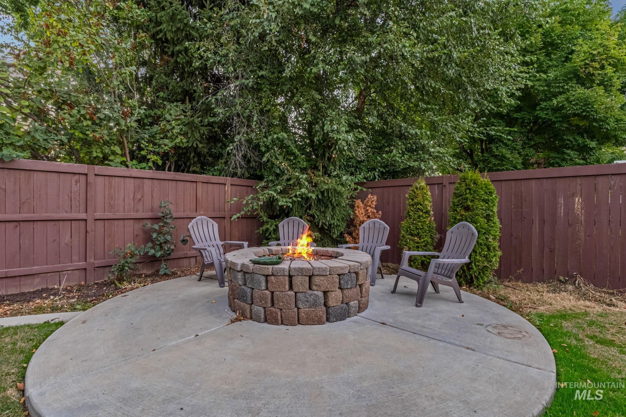 6099 North Heathrow Way Boise, ID 83713 - Photo 34 of 39 Fenced backyard with a patio