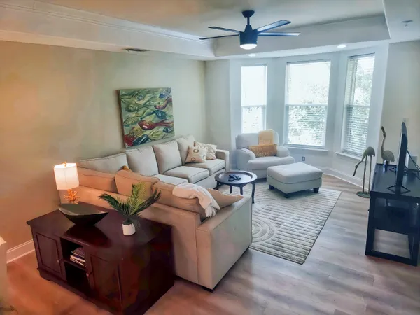 a living room with furniture and a large window