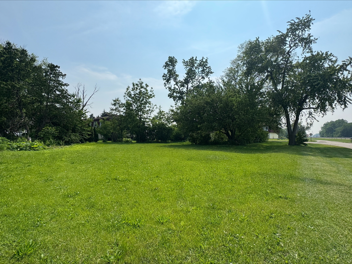 a view of outdoor space with deck and trees