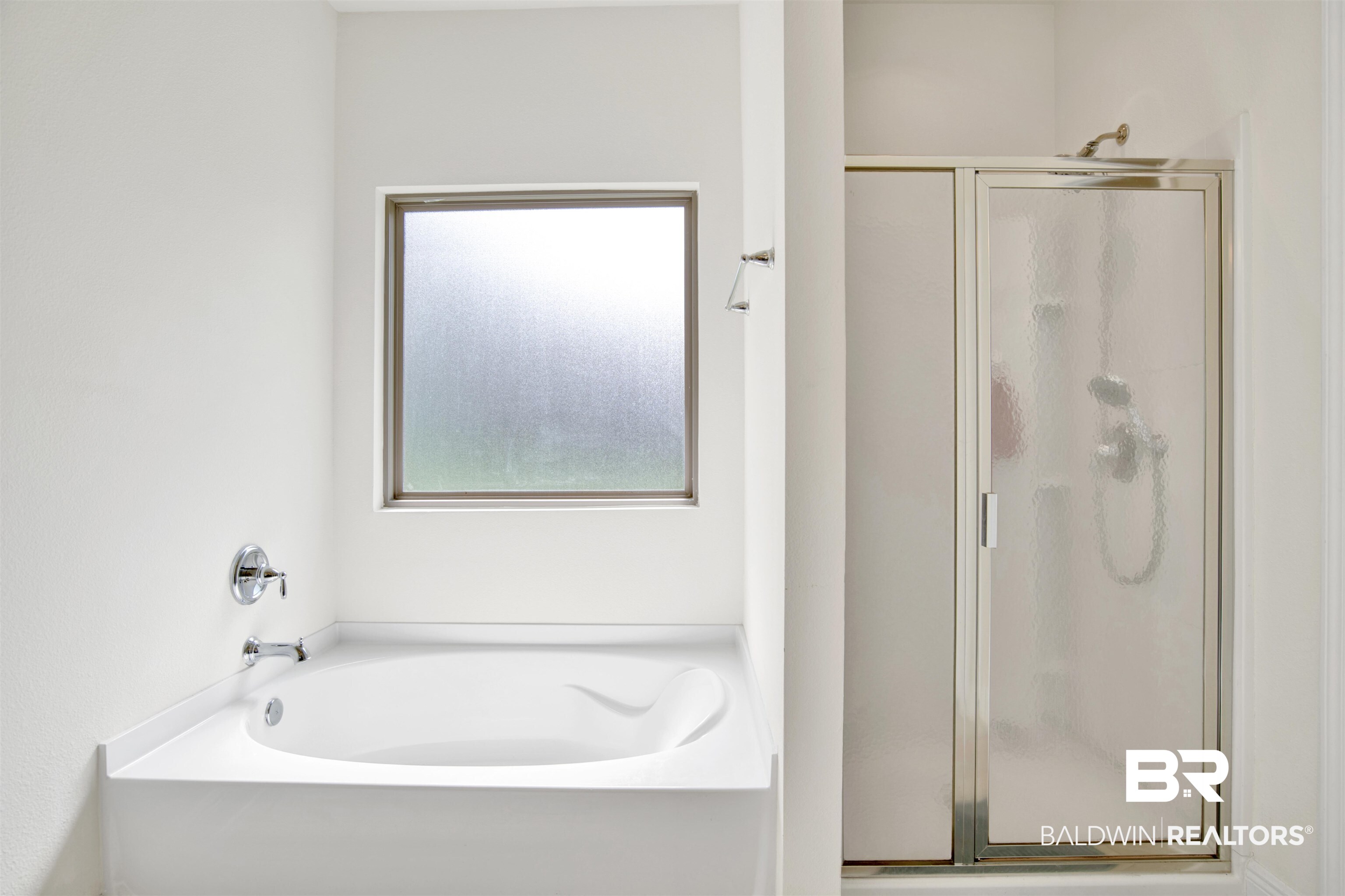 1468 Surrey Loop Foley, AL 36535 - Photo 22 of 28 Bathroom with a stall shower and a bath