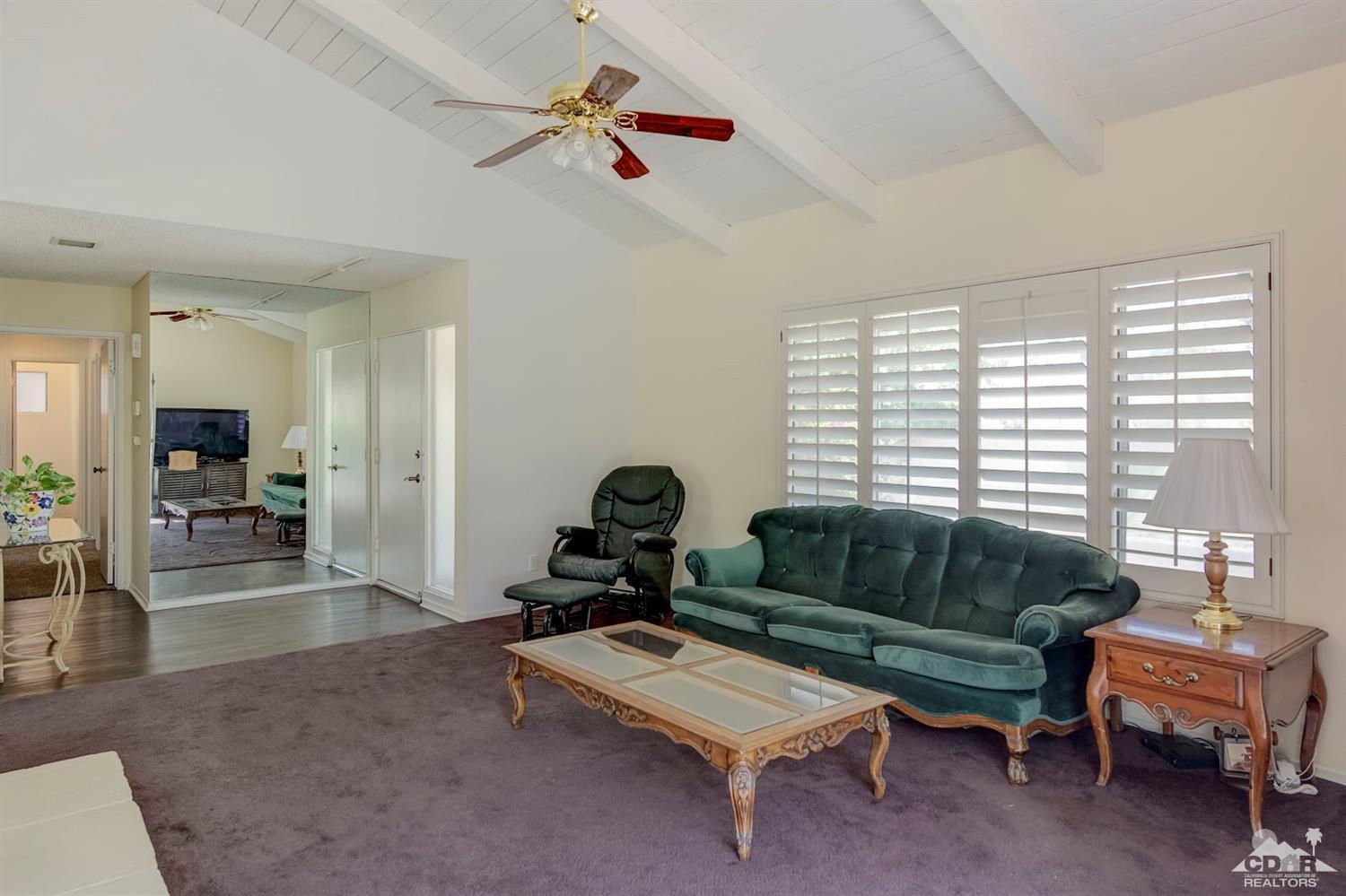 73769 Haystack Road Palm Desert, CA 92260 - Photo 13 of 34 a living room with furniture and a window