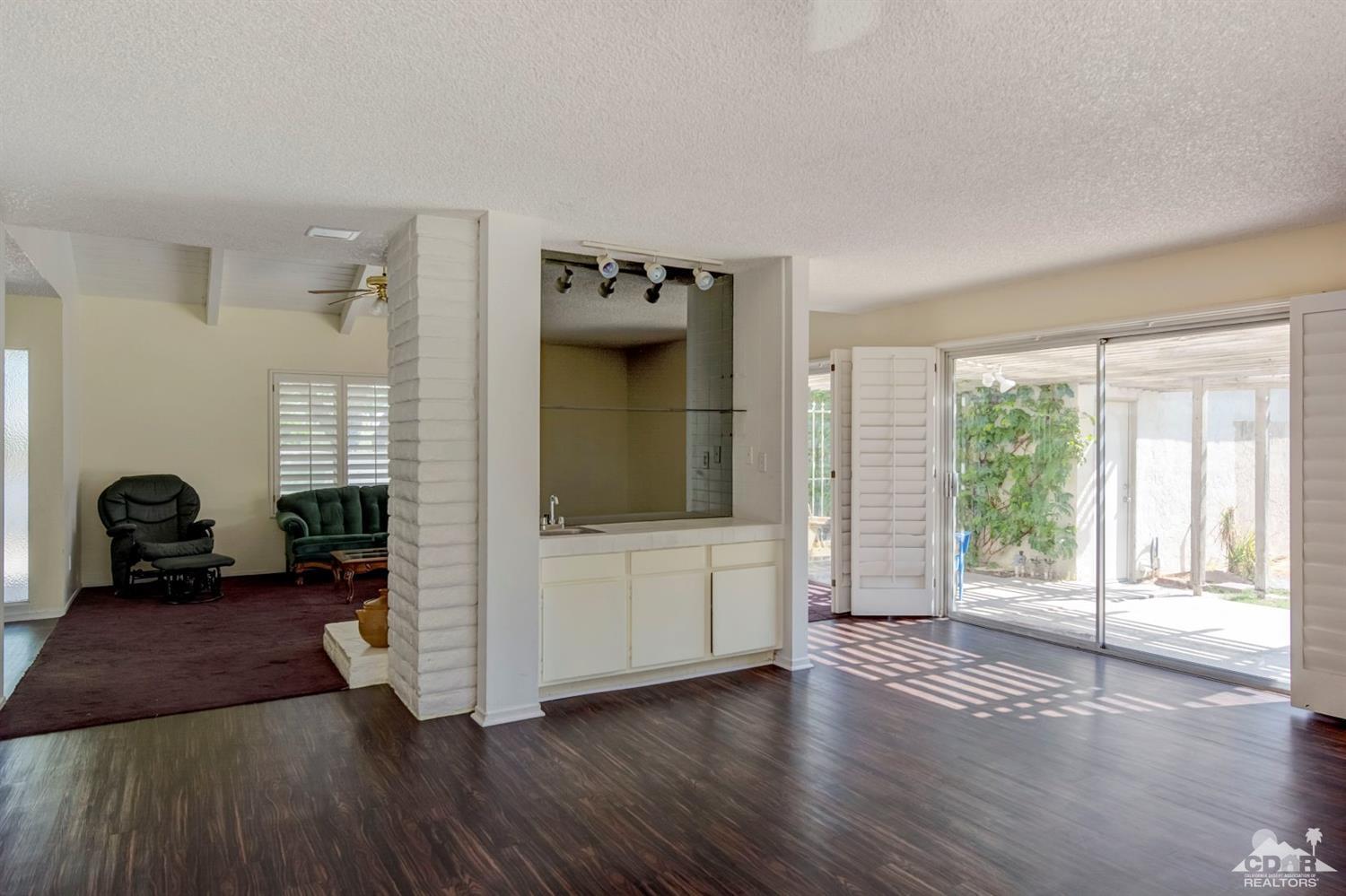 73769 Haystack Road Palm Desert, CA 92260 - Photo 14 of 34 a living room with furniture and a window