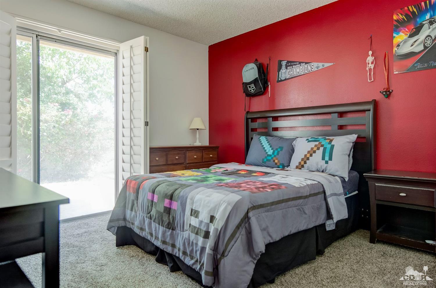 73769 Haystack Road Palm Desert, CA 92260 - Photo 22 of 34 a bedroom with a bed and window