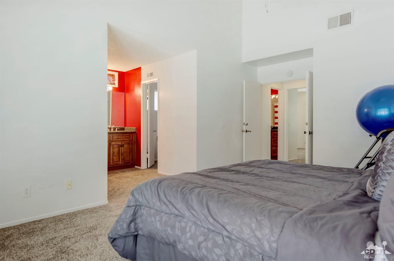 73769 Haystack Road Palm Desert, CA 92260 - Photo 30 of 34 a bedroom with a bed and a closet