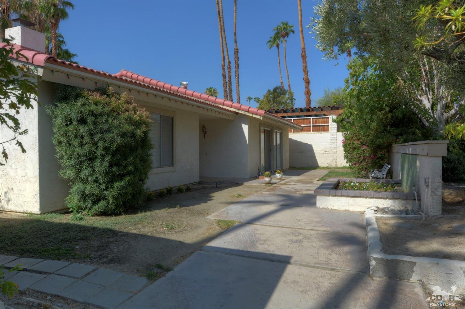 73769 Haystack Road Palm Desert, CA 92260 - Photo 5 of 34 a front view of a house with garden
