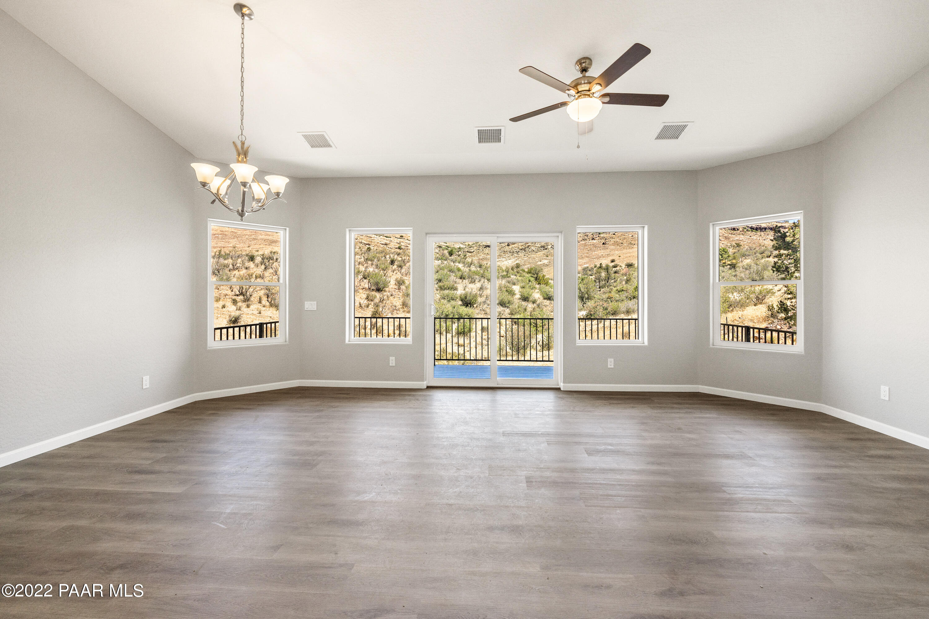 4726 East Amber Road Prescott, AZ 86301 - Photo 2 of 24 an empty room with windows and ceiling fan