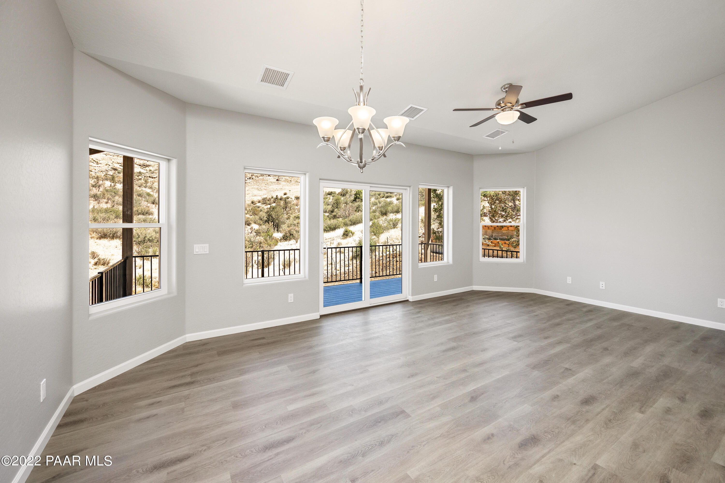 4726 East Amber Road Prescott, AZ 86301 - Photo 4 of 24 a view of an empty room with a window and wooden floor