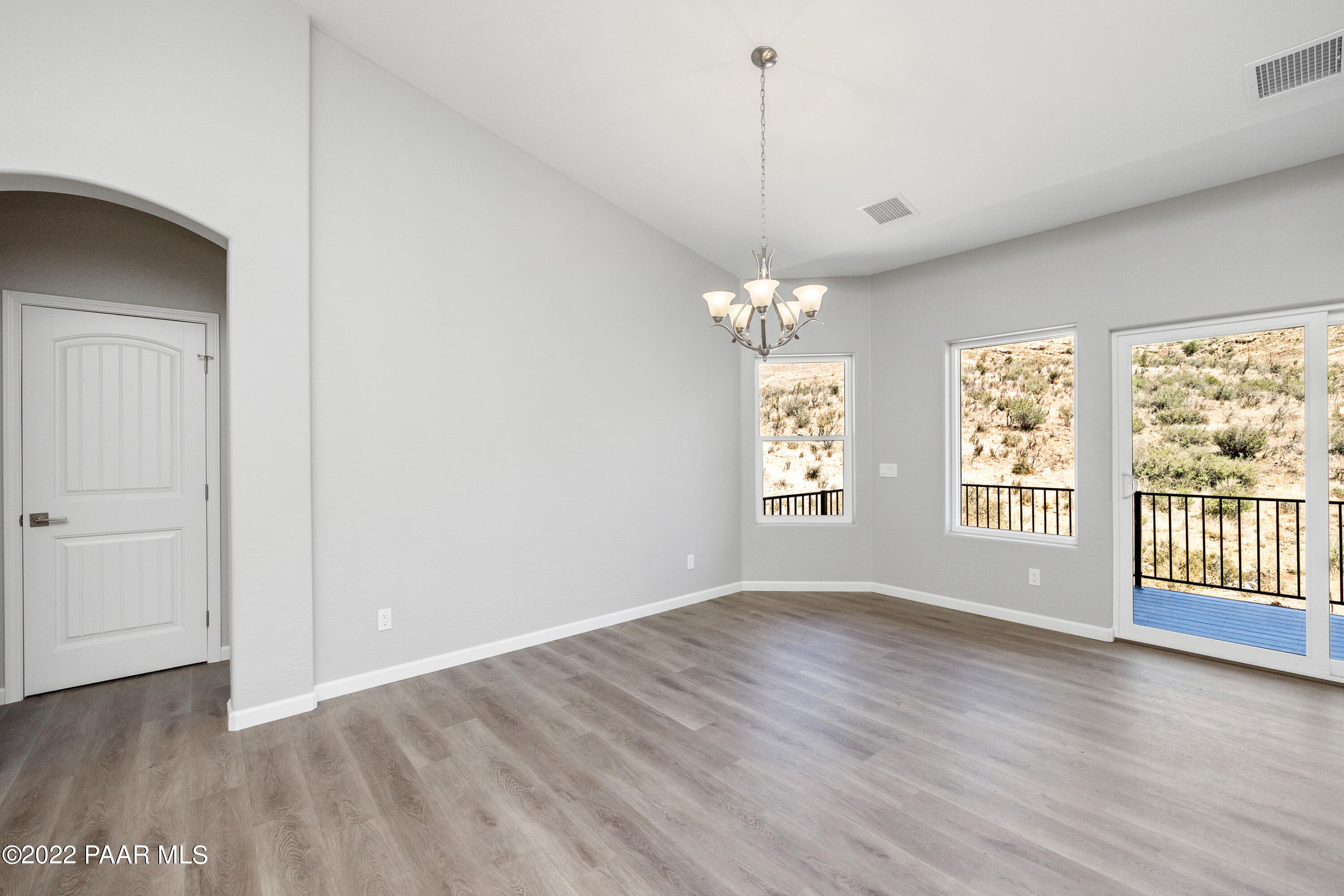 4726 East Amber Road Prescott, AZ 86301 - Photo 5 of 24 a view of an empty room with wooden floor and a window