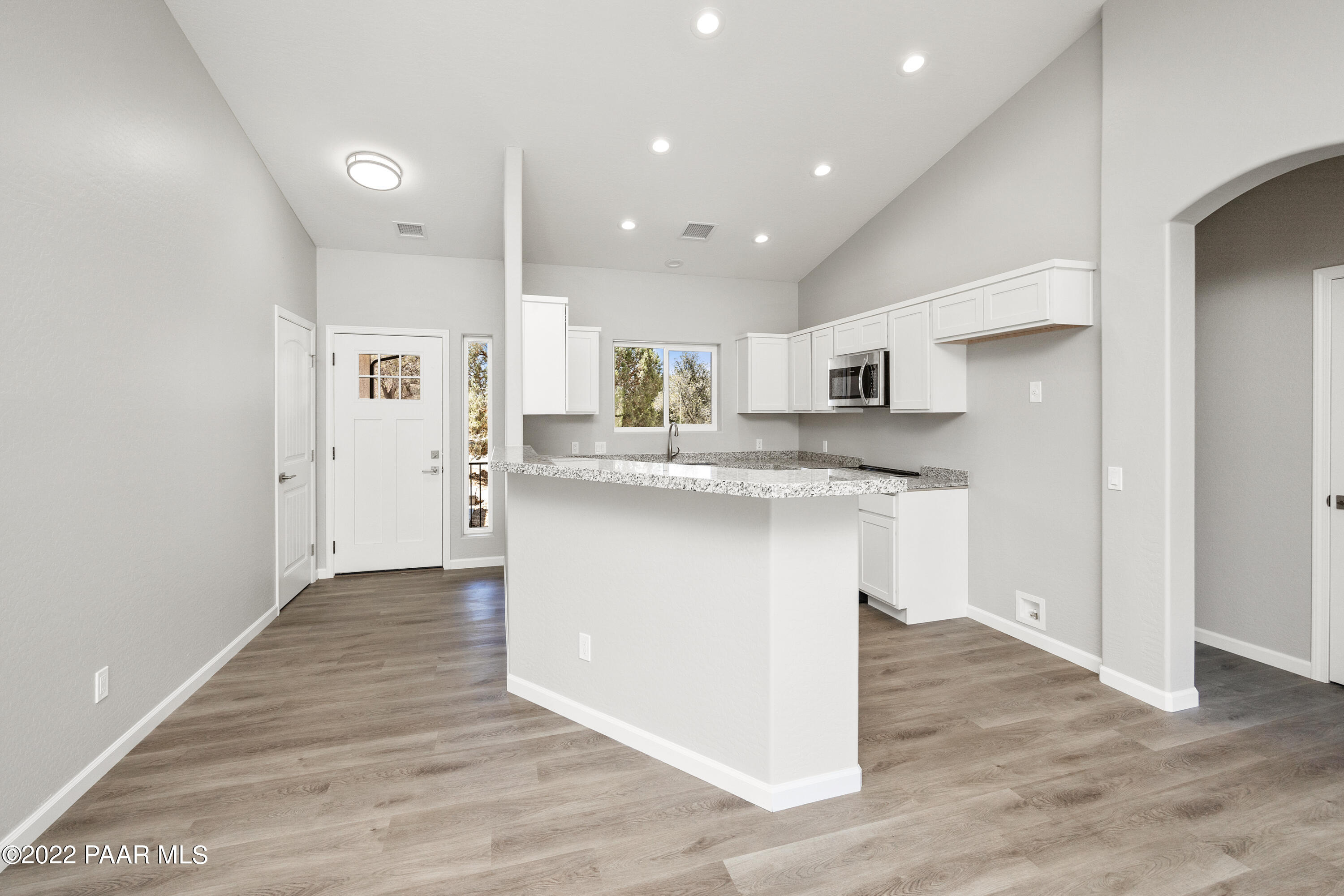 4726 East Amber Road Prescott, AZ 86301 - Photo 6 of 24 a kitchen with stainless steel appliances granite countertop a sink and a refrigerator