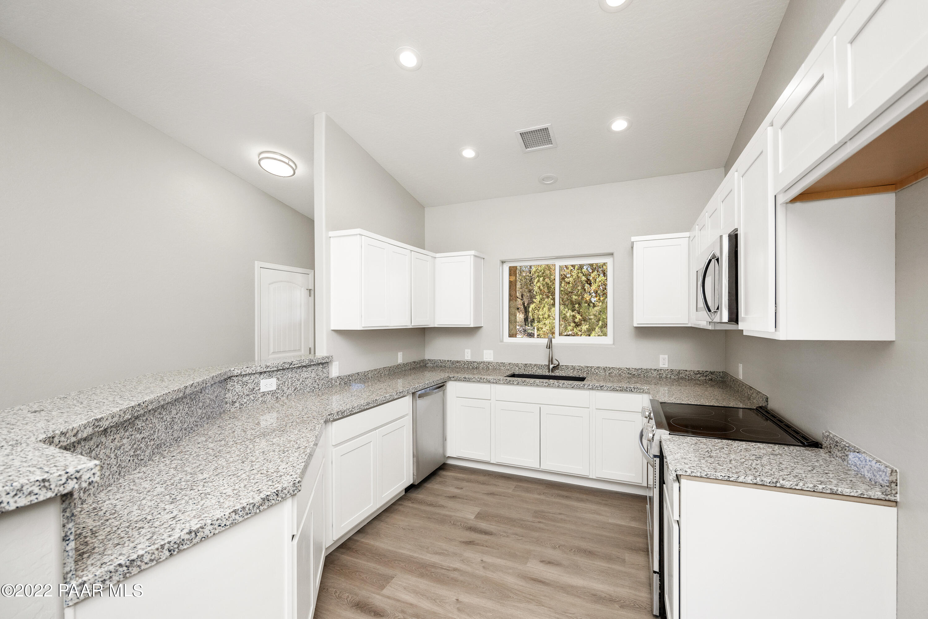 4726 East Amber Road Prescott, AZ 86301 - Photo 8 of 24 a kitchen with a sink stove and cabinets