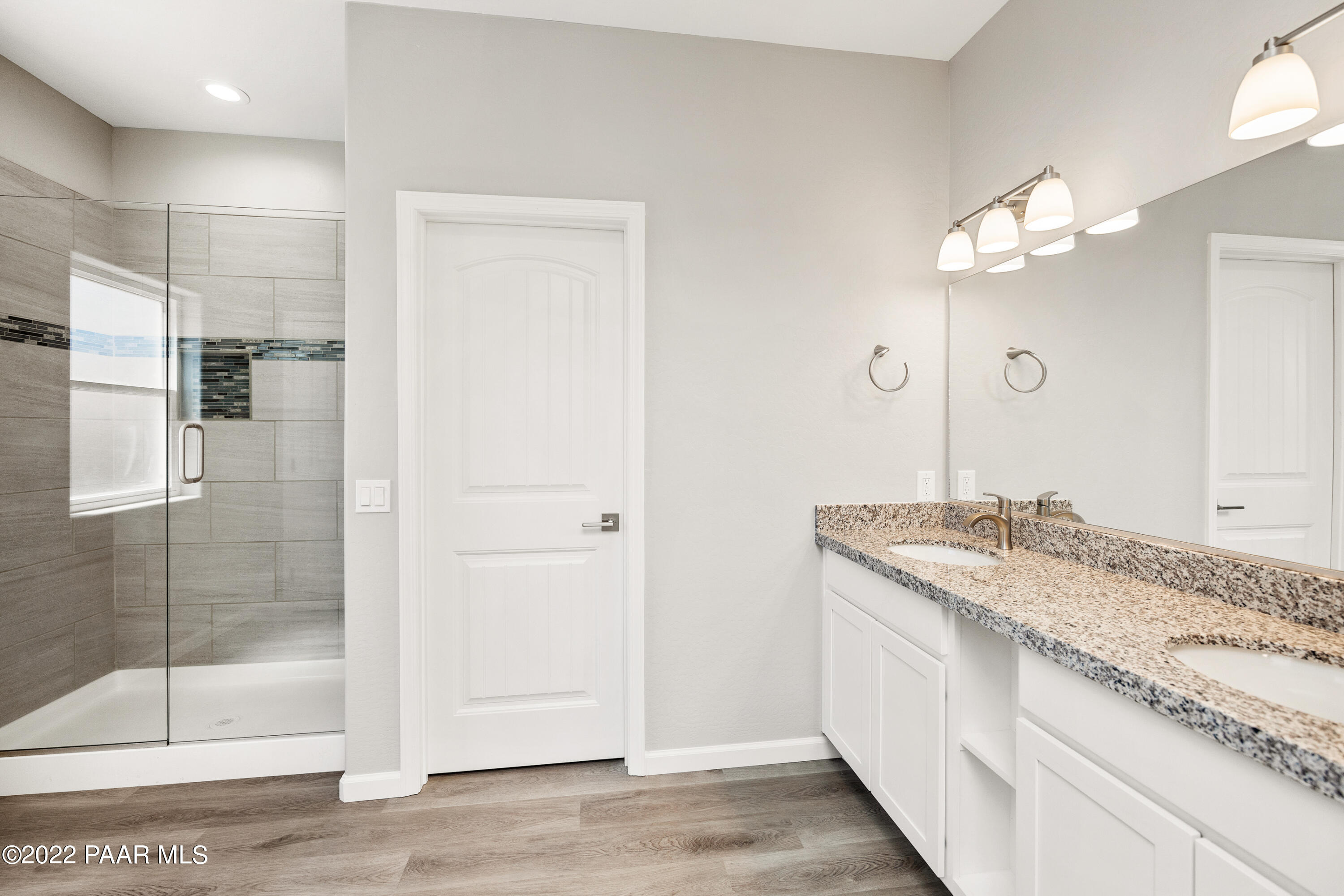 4726 East Amber Road Prescott, AZ 86301 - Photo 10 of 24 a bathroom with a granite countertop sink and a mirror