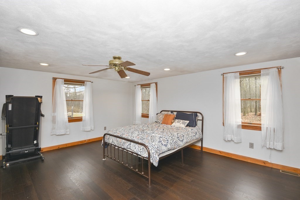 22 Carleton Road Leicester, MA 01542 - Photo 12 of 28 a living room with hard wood floors and a window