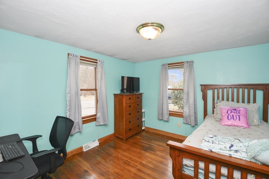 22 Carleton Road Leicester, MA 01542 - Photo 16 of 28 a bedroom with a bed and a window