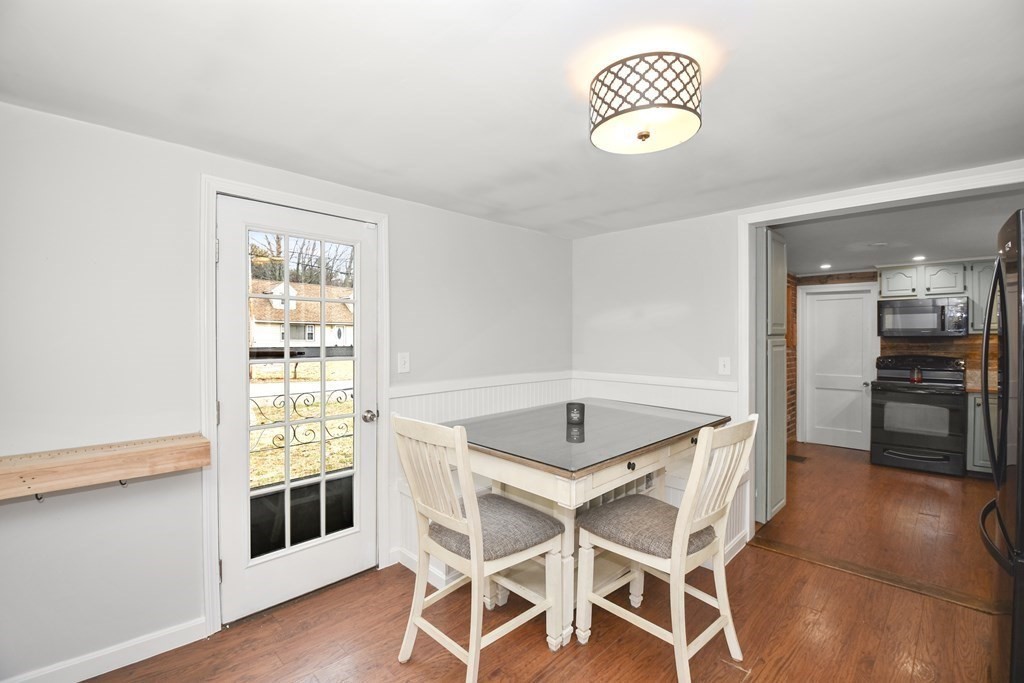 22 Carleton Road Leicester, MA 01542 - Photo 9 of 28 a kitchen with a dining table and chairs