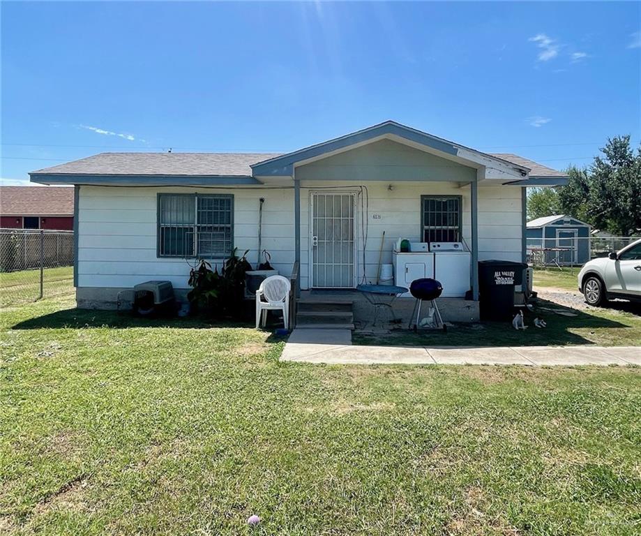 3107 North Hutto Road Donna, TX 78537 - Photo 1 of 11 a front view of house with yard outdoor seating and barbeque oven