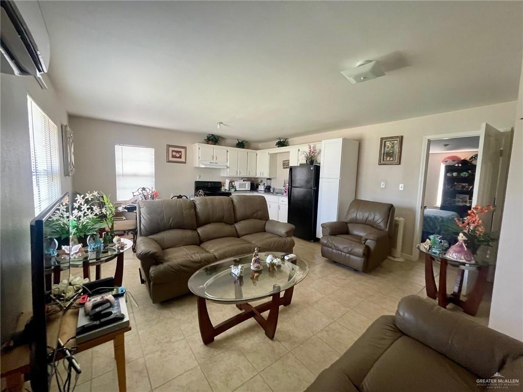 3107 North Hutto Road Donna, TX 78537 - Photo 4 of 11 a living room with furniture potted plant and a window