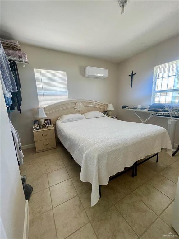 3107 North Hutto Road Donna, TX 78537 - Photo 7 of 11 a bedroom with a bed and a window