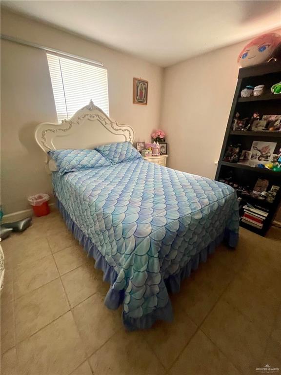 3107 North Hutto Road Donna, TX 78537 - Photo 8 of 11 a bedroom with a bed and a window