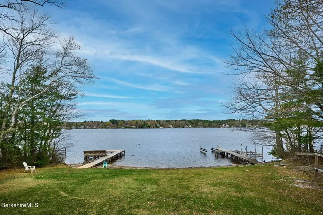 a view of a large body of water with a building in the background