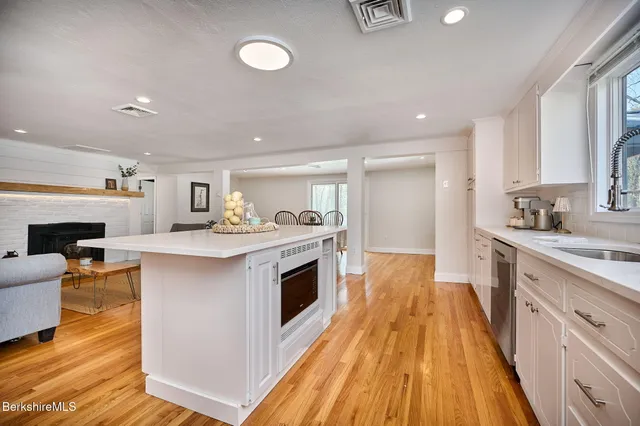 a kitchen with a sink and a stove top oven