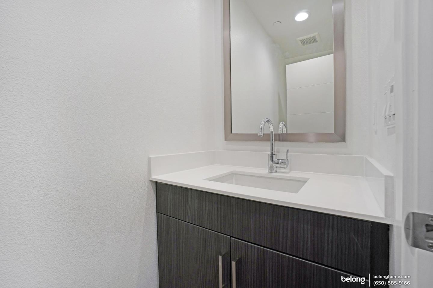 1351 Pullman Way Oakland, CA 94607 - Photo 21 of 24 a bathroom with a sink and a mirror