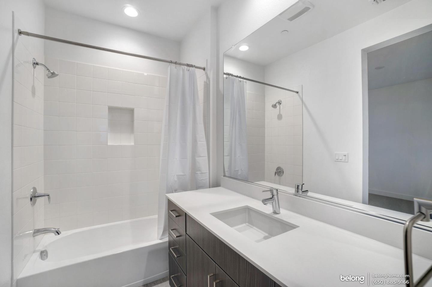 1351 Pullman Way Oakland, CA 94607 - Photo 22 of 24 a bathroom with a sink and a mirror