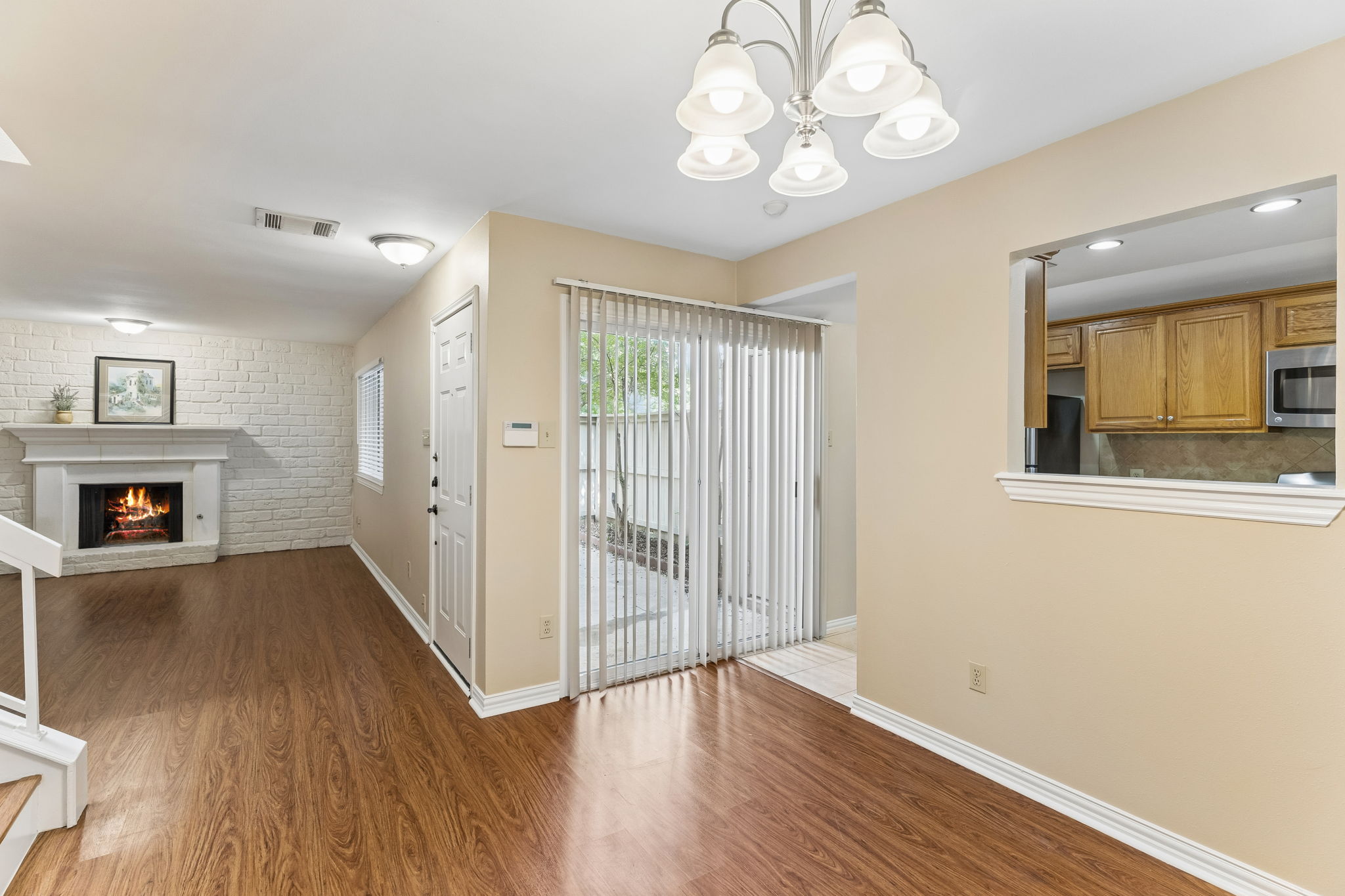8340 Fathom Circle, Unit 103 Austin, TX 78750 - Photo 13 of 30 wooden floor in an empty room with a window