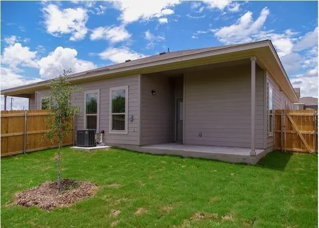 a view of a back yard of the house