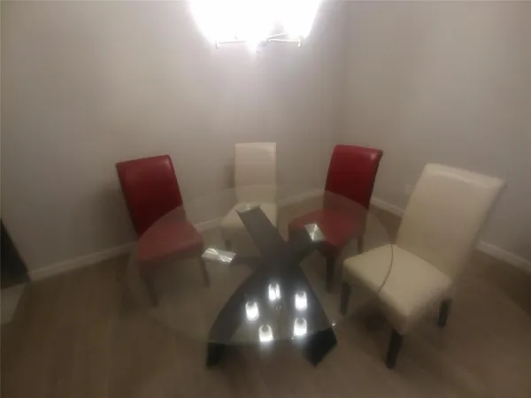 a view of a room with chair and wooden floor