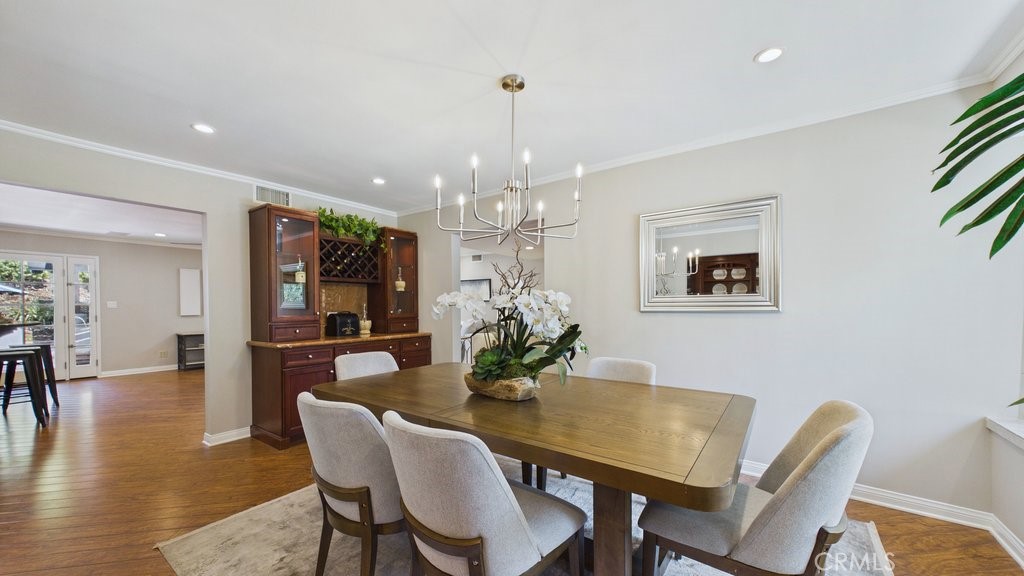 340 Toyon Road Sierra Madre, CA 91024 - Photo 17 of 60 Formal dining area view from the butler's pantry, featuring the kitchen entrance on the left.