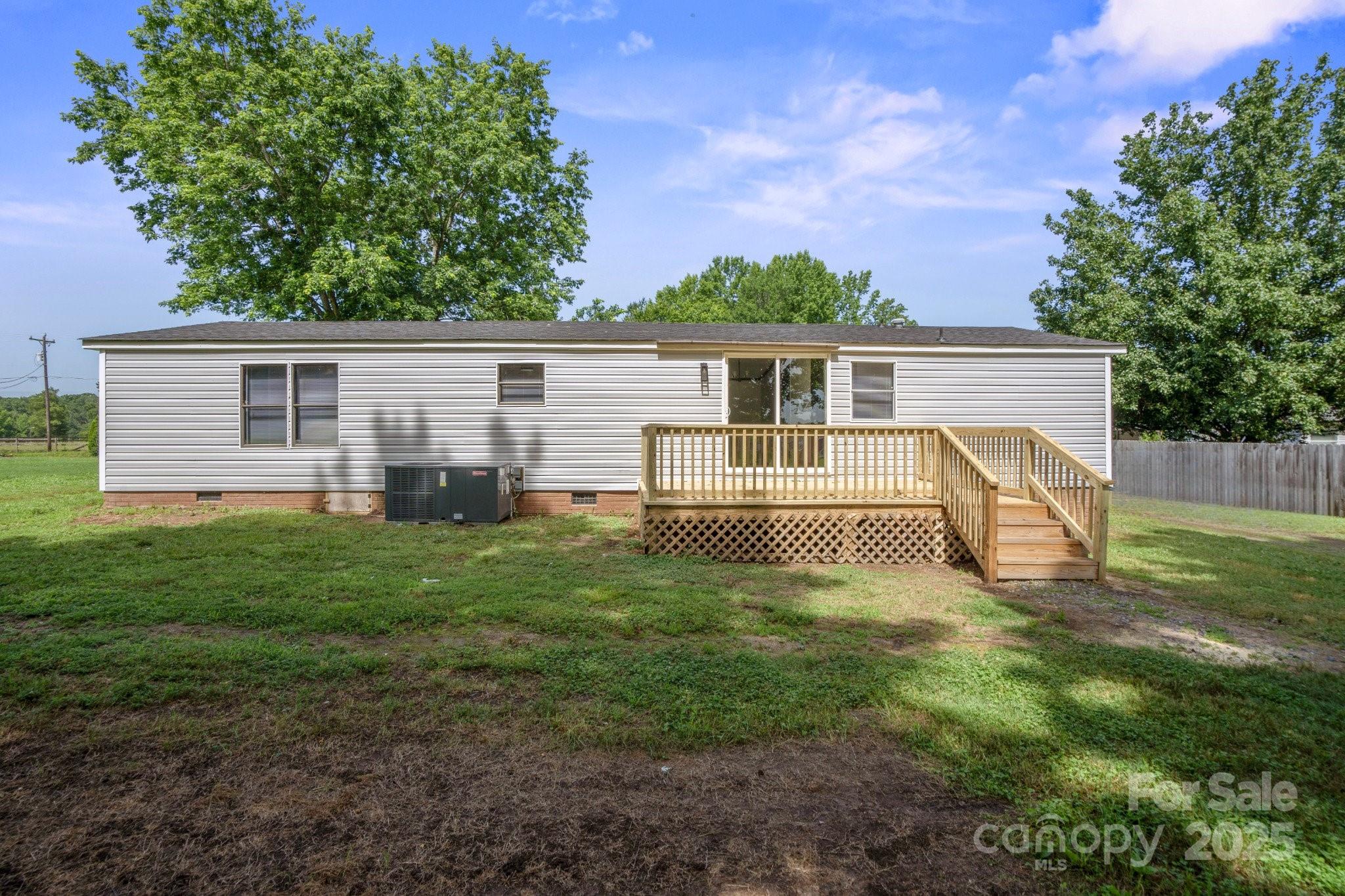 6085 Faith Road Salisbury, NC 28146 - Photo 26 of 29 a view of a house with a backyard