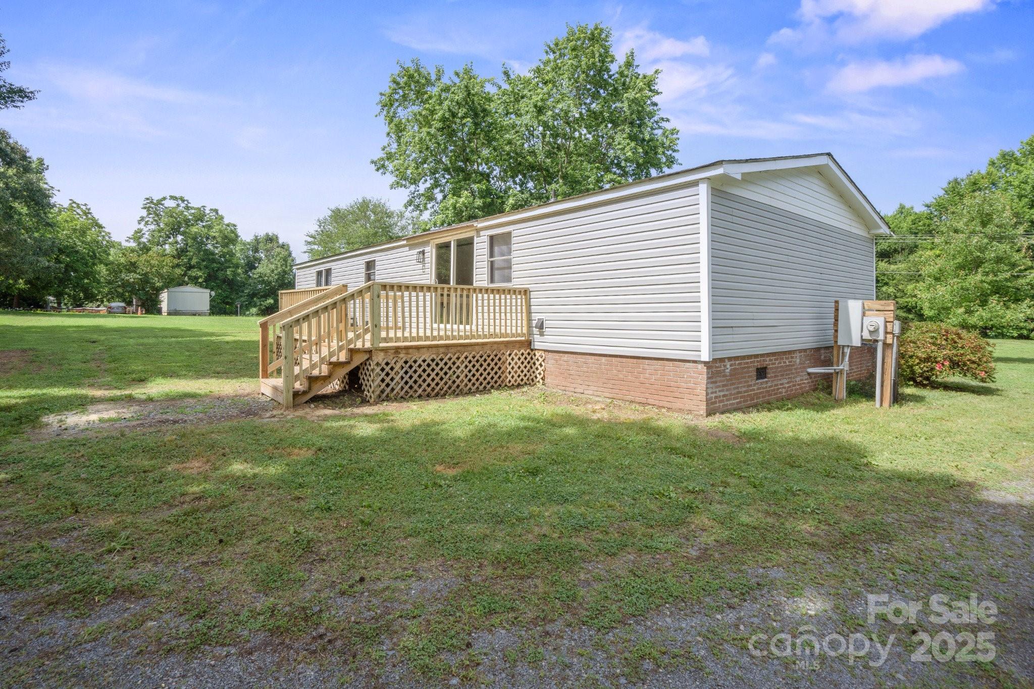 6085 Faith Road Salisbury, NC 28146 - Photo 27 of 29 a backyard of a house with table and chairs