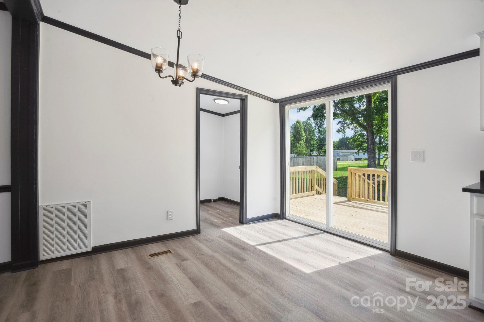 6085 Faith Road Salisbury, NC 28146 - Photo 5 of 29 a view of a room with a large window