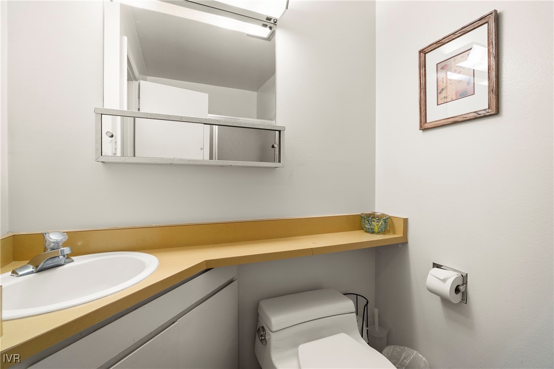 321 Ski Way, Unit 24 Incline Village, NV 89451 - Photo 14 of 31 a bathroom with a sink and a toilet