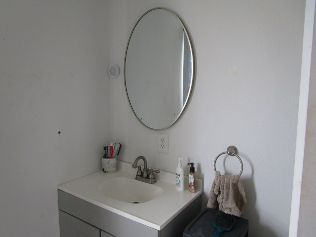 89-902 Rd Road Captain Cook, HI 96704 - Photo 12 of 30 a bathroom with a sink and mirror