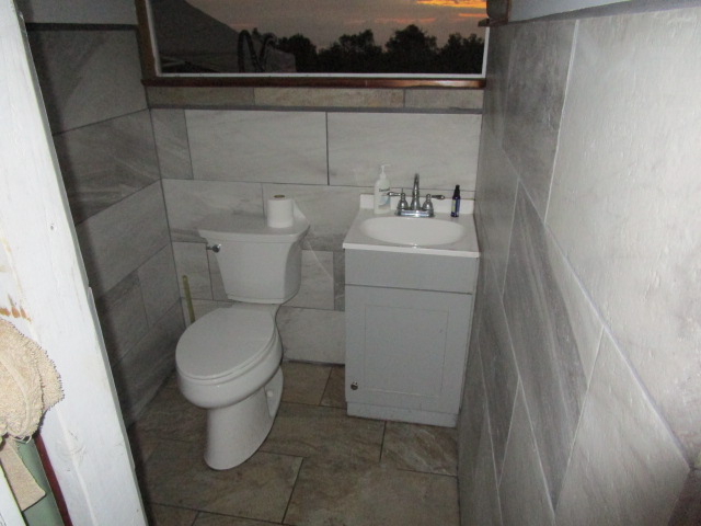 89-902 Rd Road Captain Cook, HI 96704 - Photo 20 of 30 a bathroom with a sink and a toilet